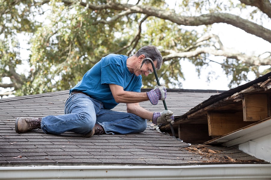 man removing Roof Flashing